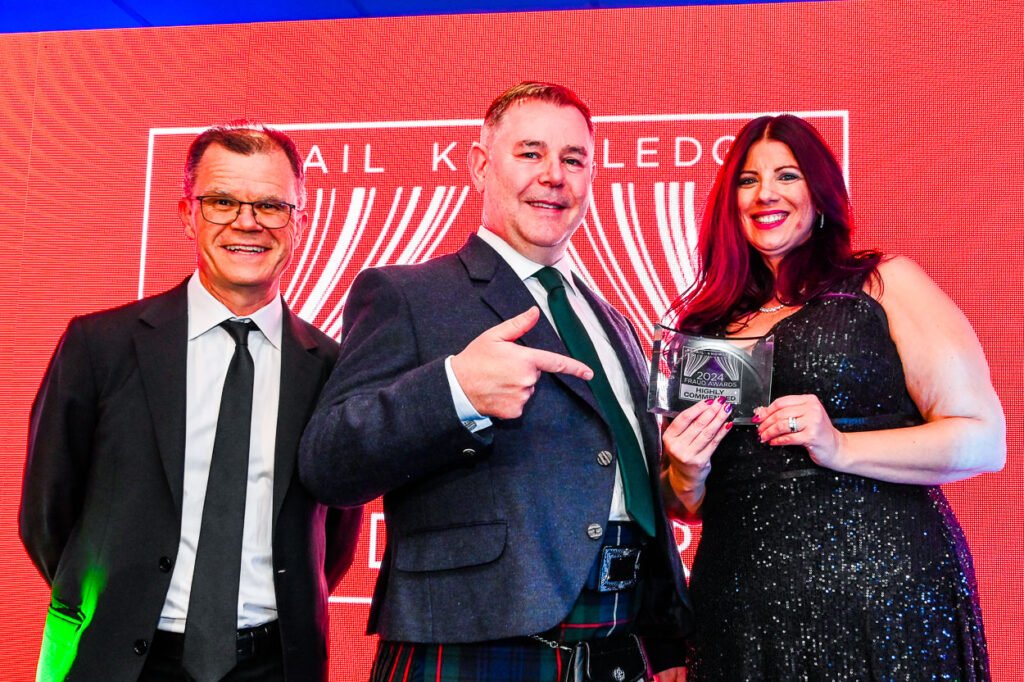 Photograph of Award Presentation on stage at an event