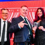 Photograph of Award Presentation on stage at an event