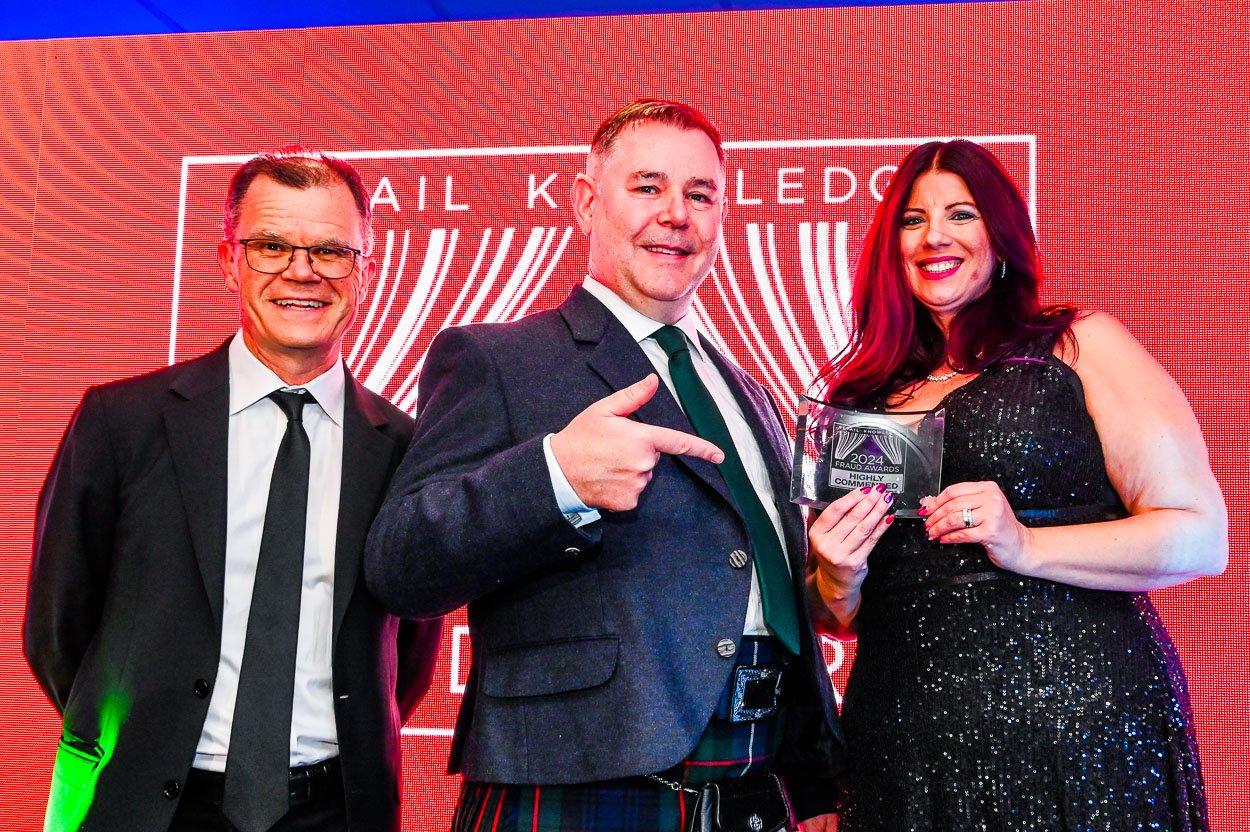 Photograph of Award Presentation on stage at an event