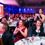 Photograph - Audience applauding at formal awards evening