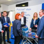 Photograph - people in conversation at a exhibitor stand at a trade show