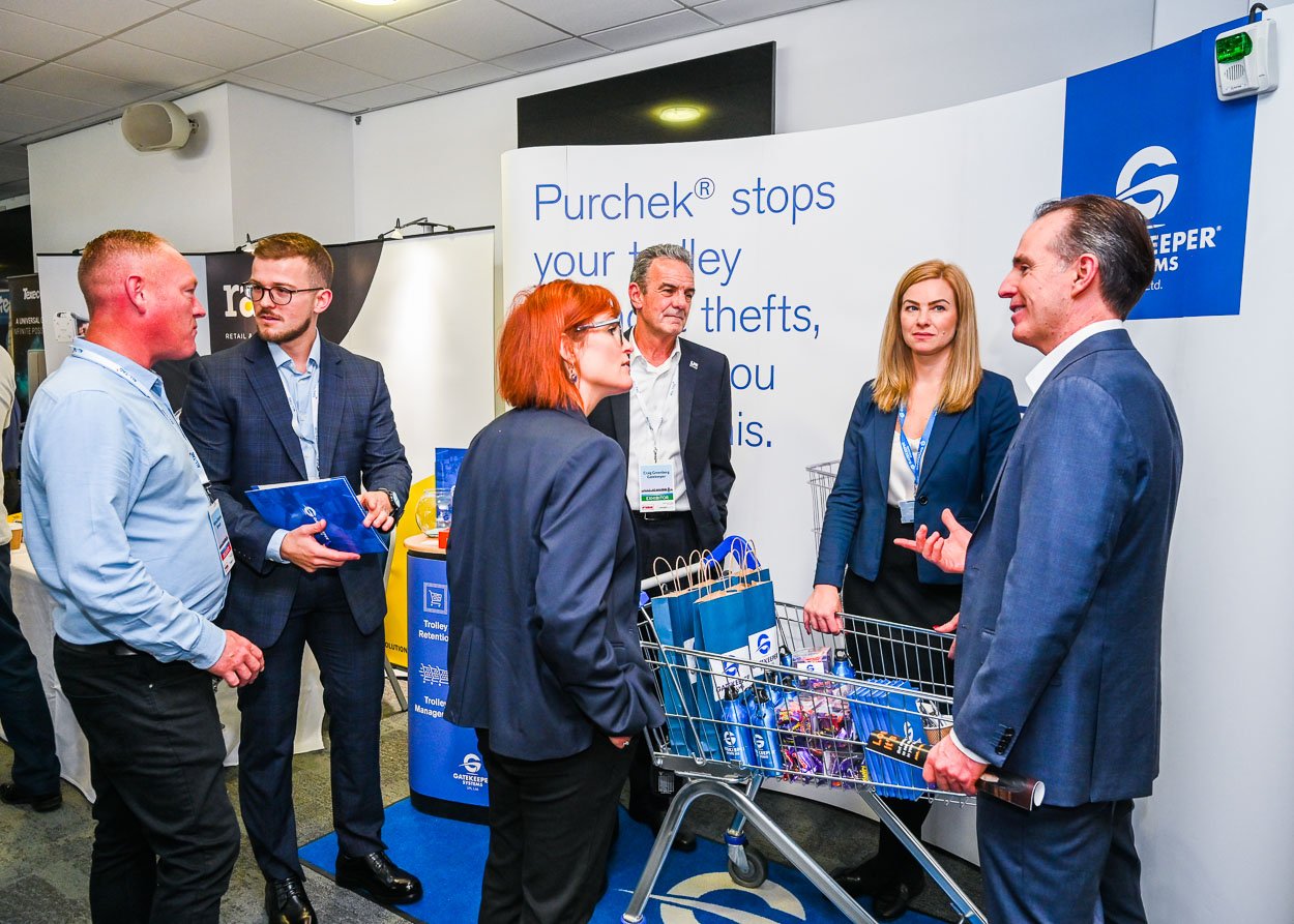 Photograph - people in conversation at a exhibitor stand at a trade show