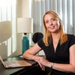 Portrait photograph - female professional seated with laptop