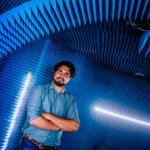 Portrait photo of microwave technology engineer in anechoic chamber