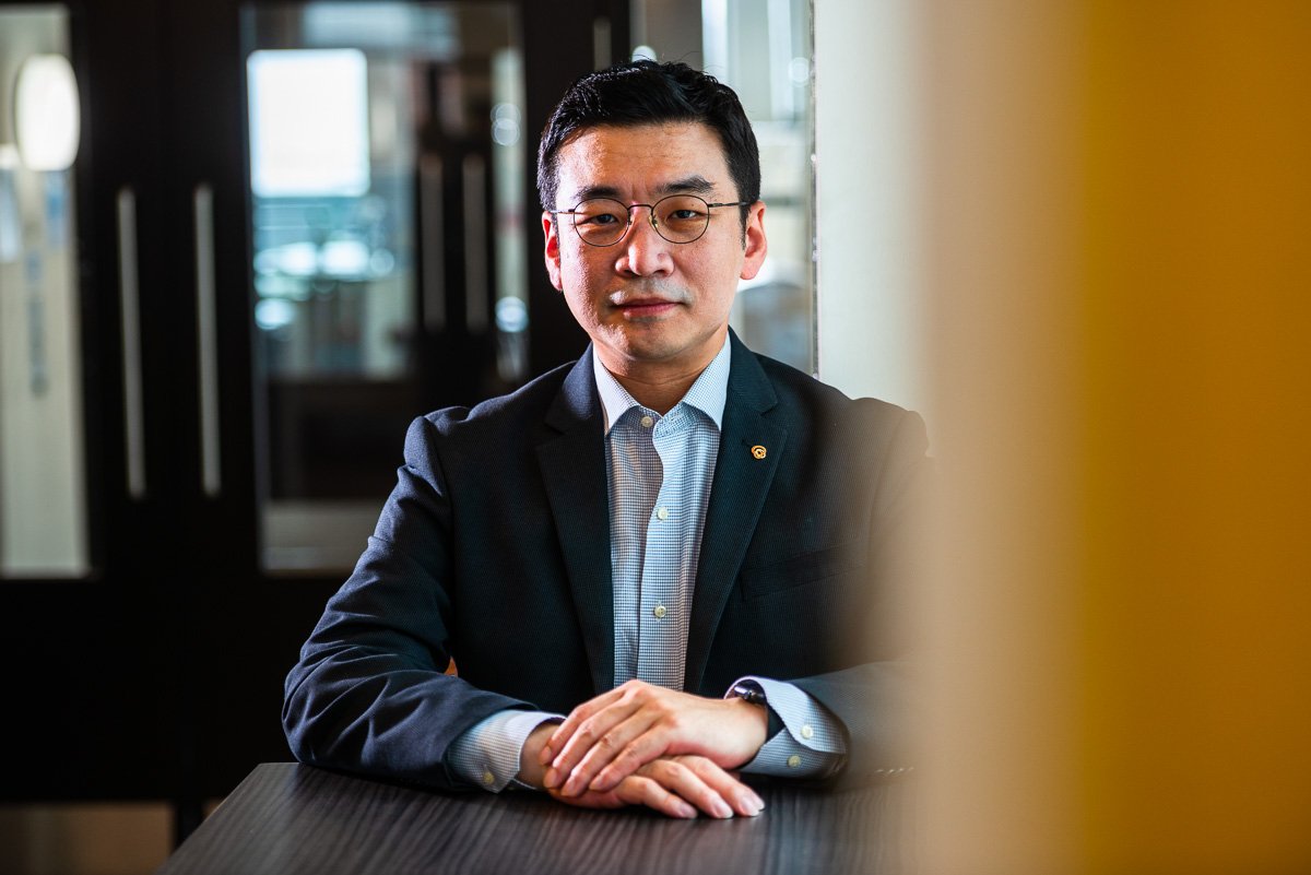 Portrait photograph, seated Korean businessman