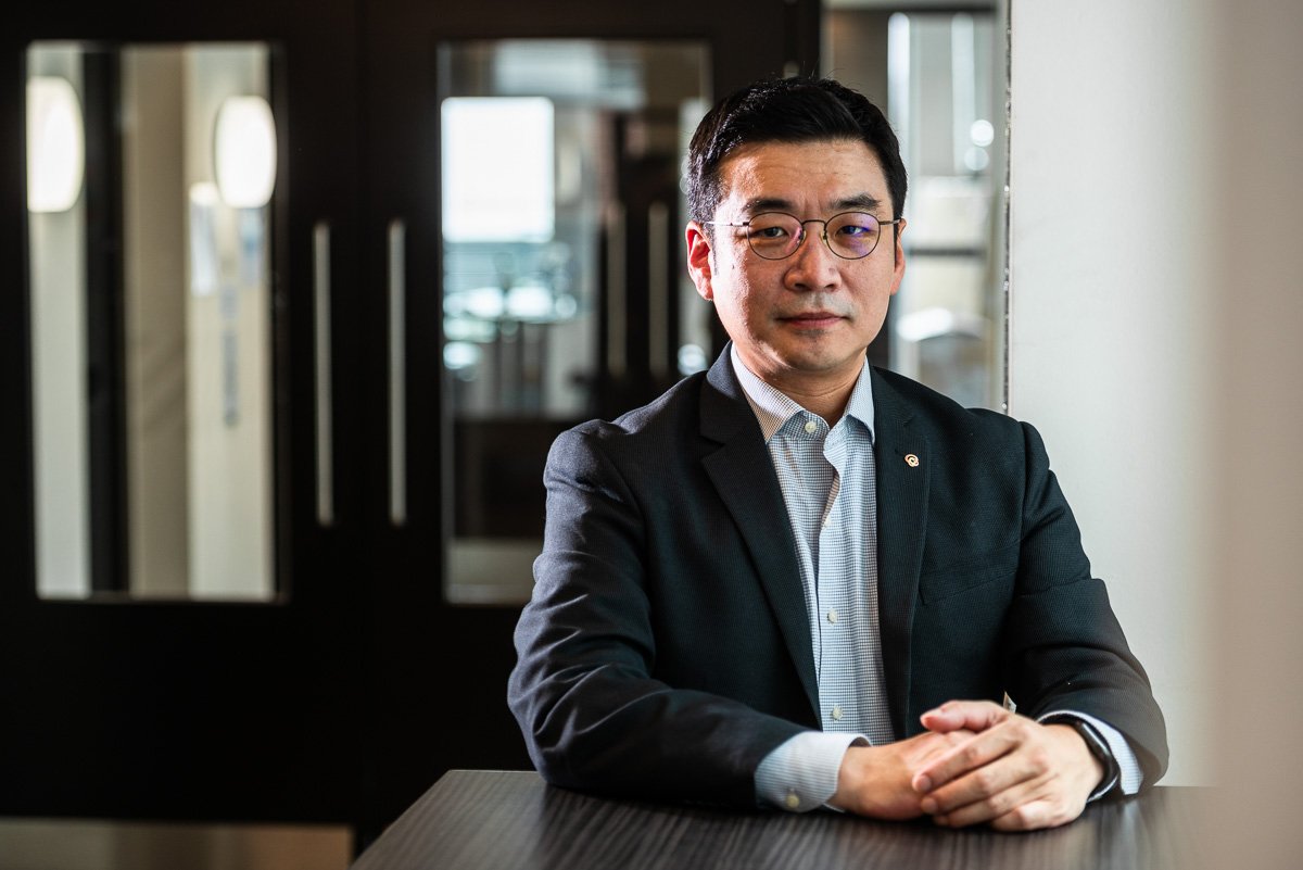 Portrait photograph, seated Korean businessman
