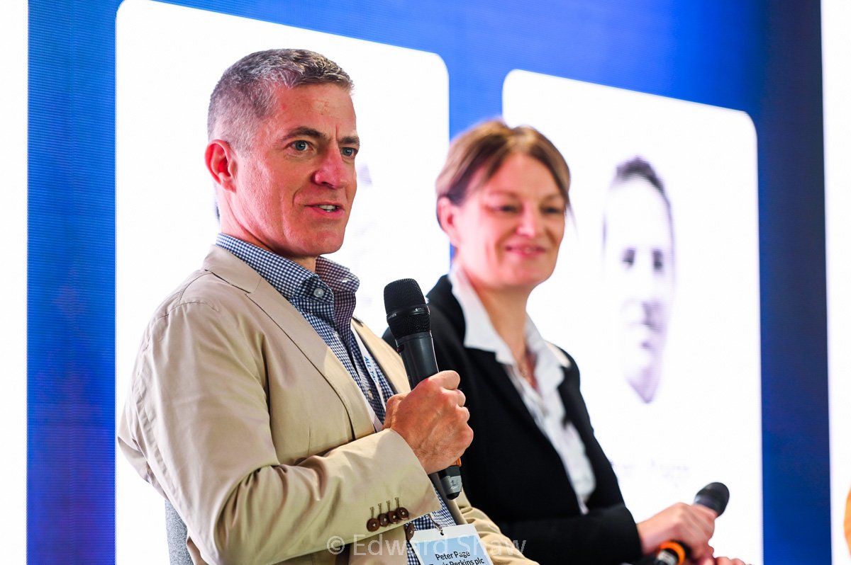 Close up photograph of man speaking on stage at a Retail Risk conference in Leicester UK