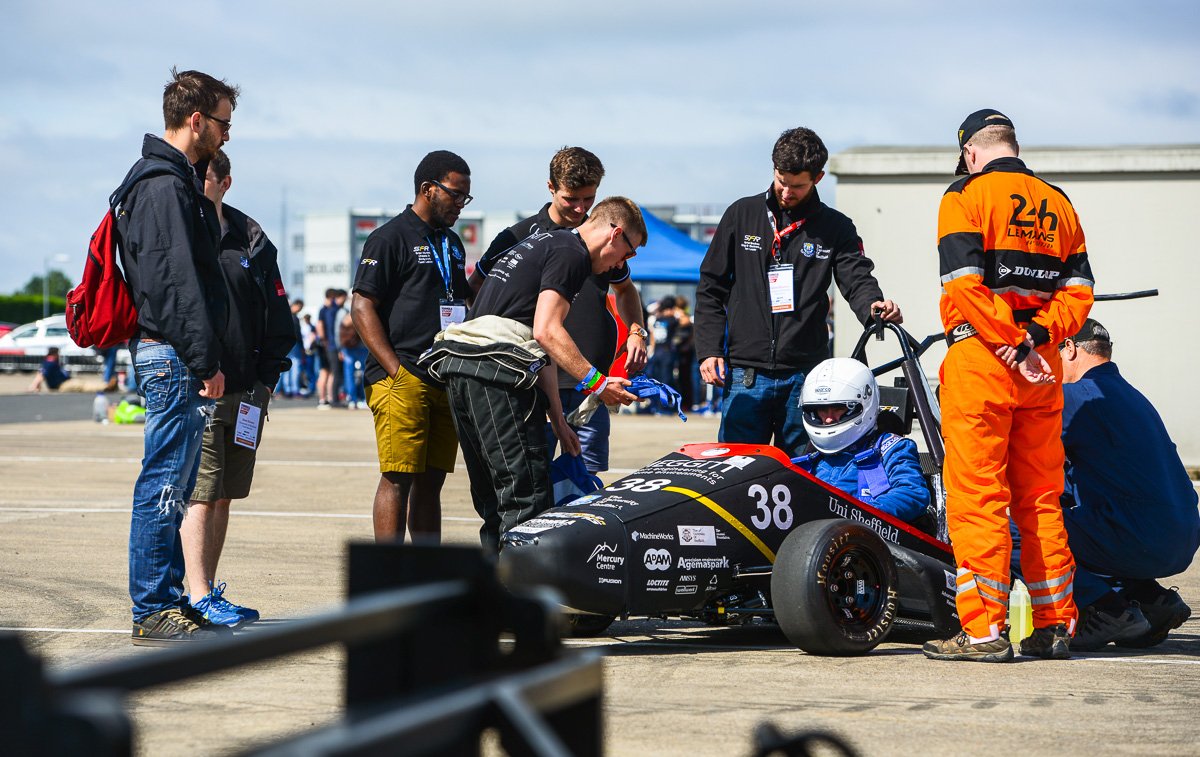 Student engineers working on Formula Student race car