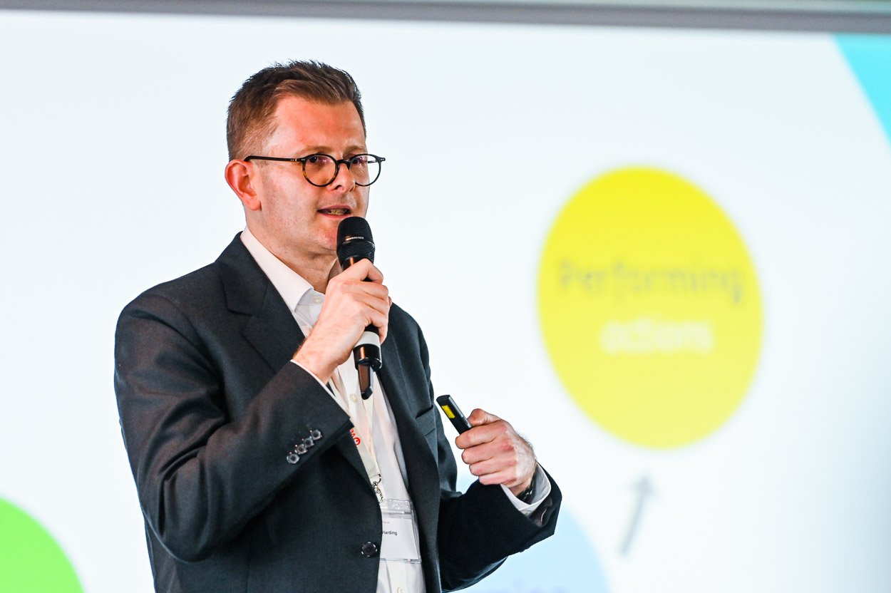 Man speaking on stage, business conference, Birmingham