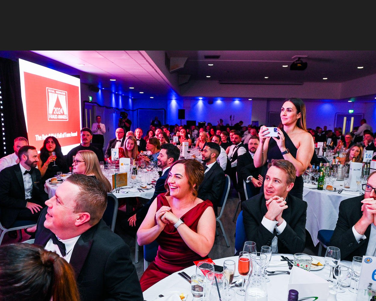 Photo Smiling Appreciative Audience at Black Tie Event